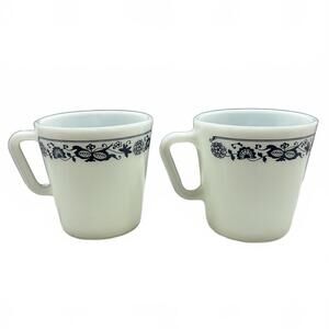Vintage Pyrex Old Town Blue Onion milk glass mugs with diagonal handles.